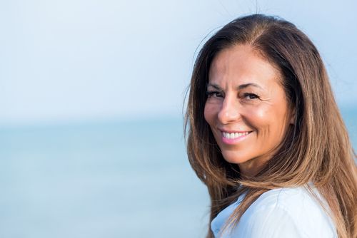senior-woman-on-beach-p-500.jpg