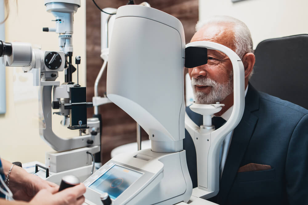 Older man having his eyes examined