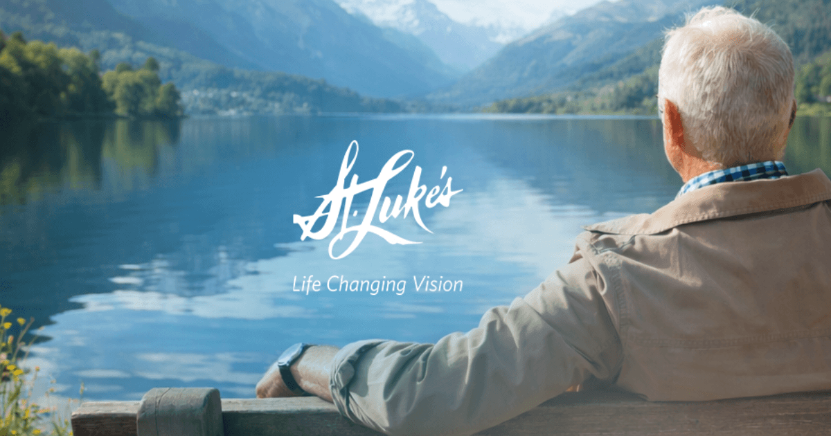 Older adult seated on a bench overlooking a calm lake with mountains in the distance, illustrating long-term vision and lifestyle outcomes associated with LASIK and age-related changes in eyesight